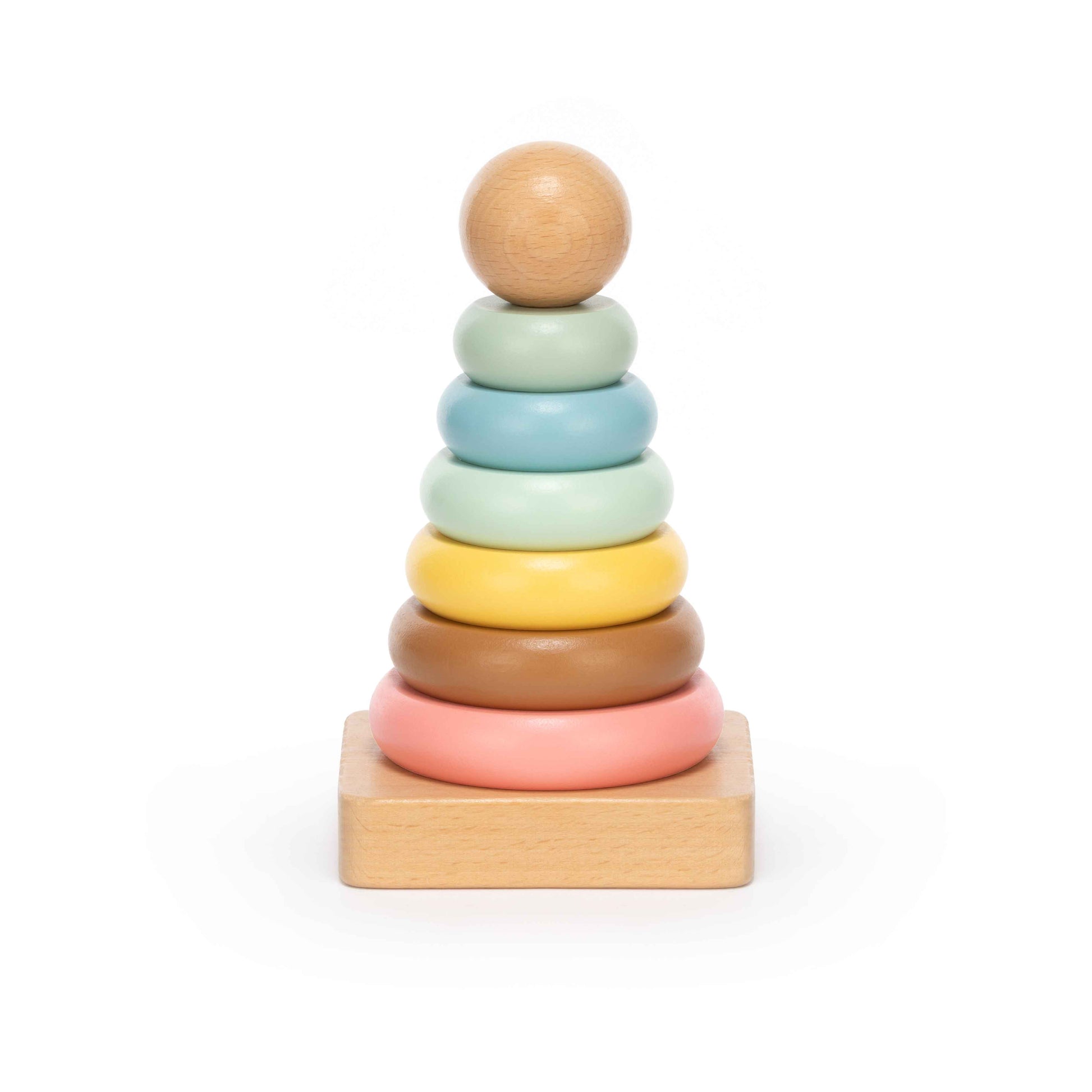 Pastel wooden stacking ring toy with seven soft-coloured rings on a natural wood base, photographed on a clean white background
