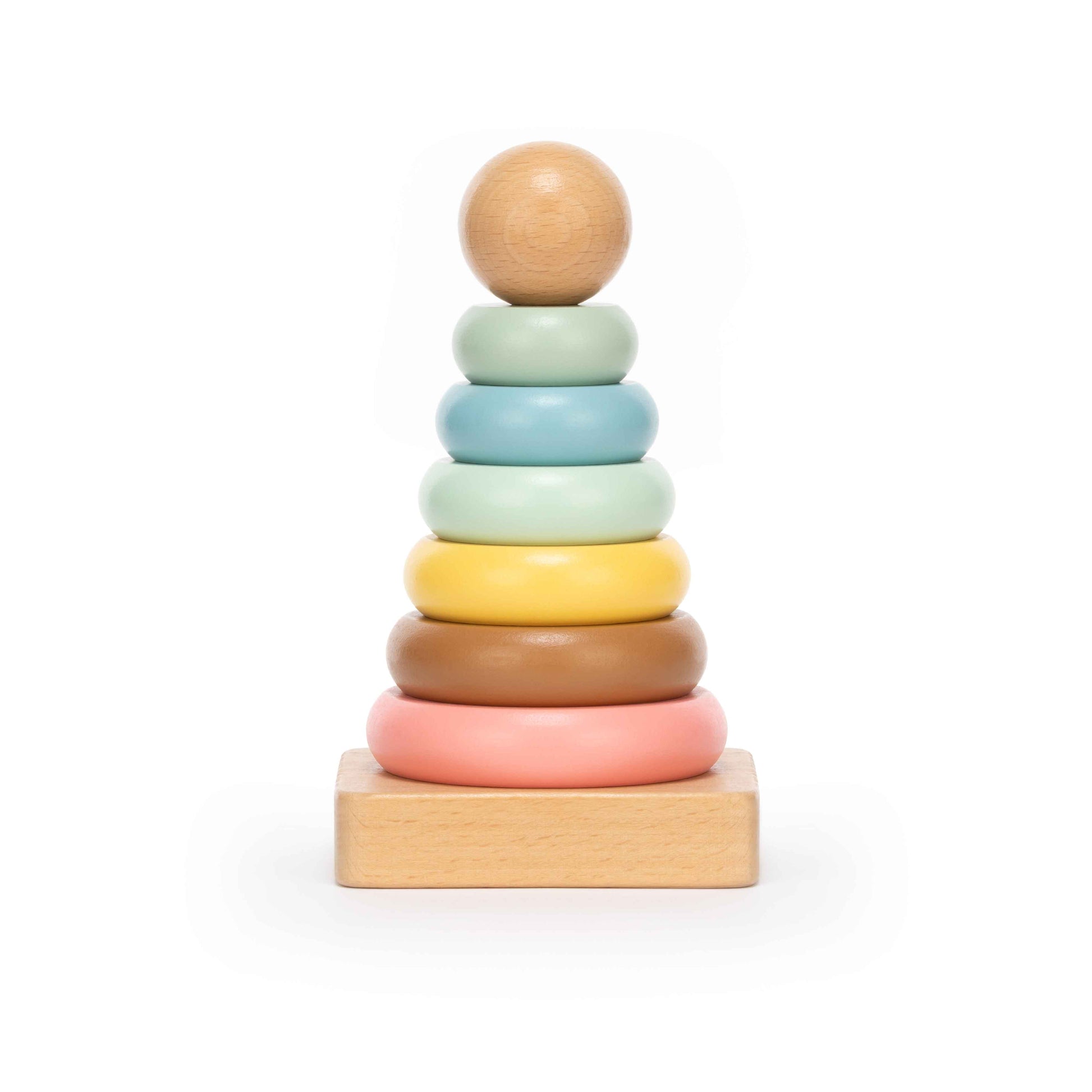 Pastel wooden stacking ring toy with seven soft-coloured rings on a natural wood base, photographed on a clean white background