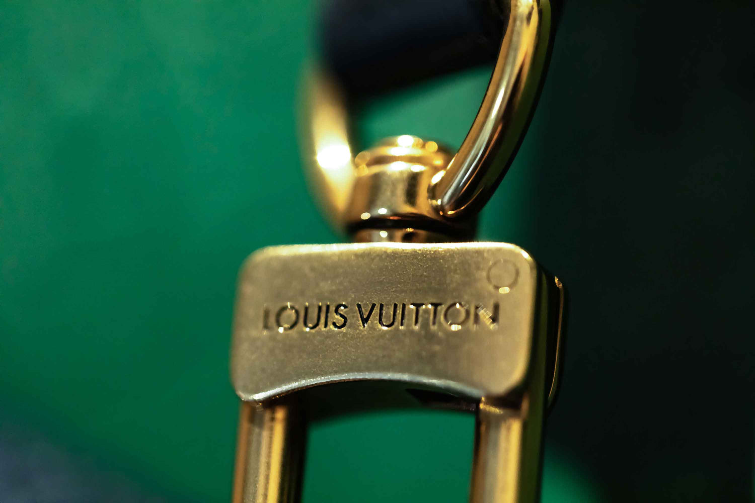 A luxury macro photography series showcasing close-up gold designer handbag hardware, polished metallic details and textured black leather. Captured with dramatic lighting, shallow depth of field and rich editorial styling, these images highlight premium fashion craftsmanship, elegant accessory design and high-end product detail.