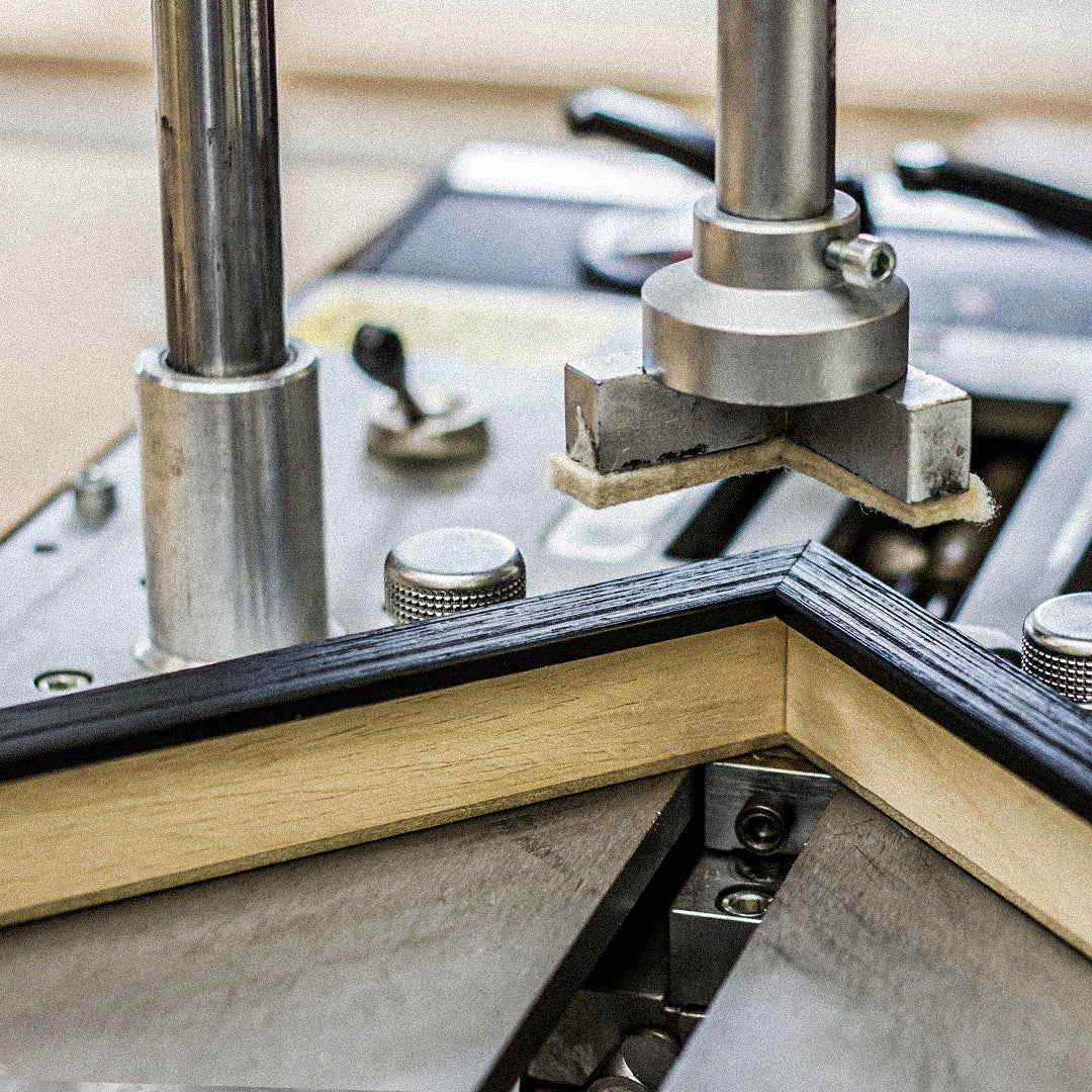 Behind the scenes workshop photography showing handcrafted framing, print finishing and creative production processes. These documentary style images capture the care, detail and craftsmanship behind Quindie’s art prints, framed artwork and design led products.